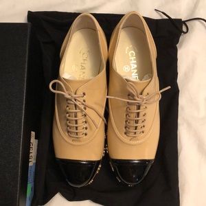 Chanel lace up shoes.